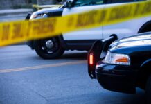 Farmington New Mexico Police Shoot, Kill Wrong Man Police tape and barricade crime scene with cars after incident