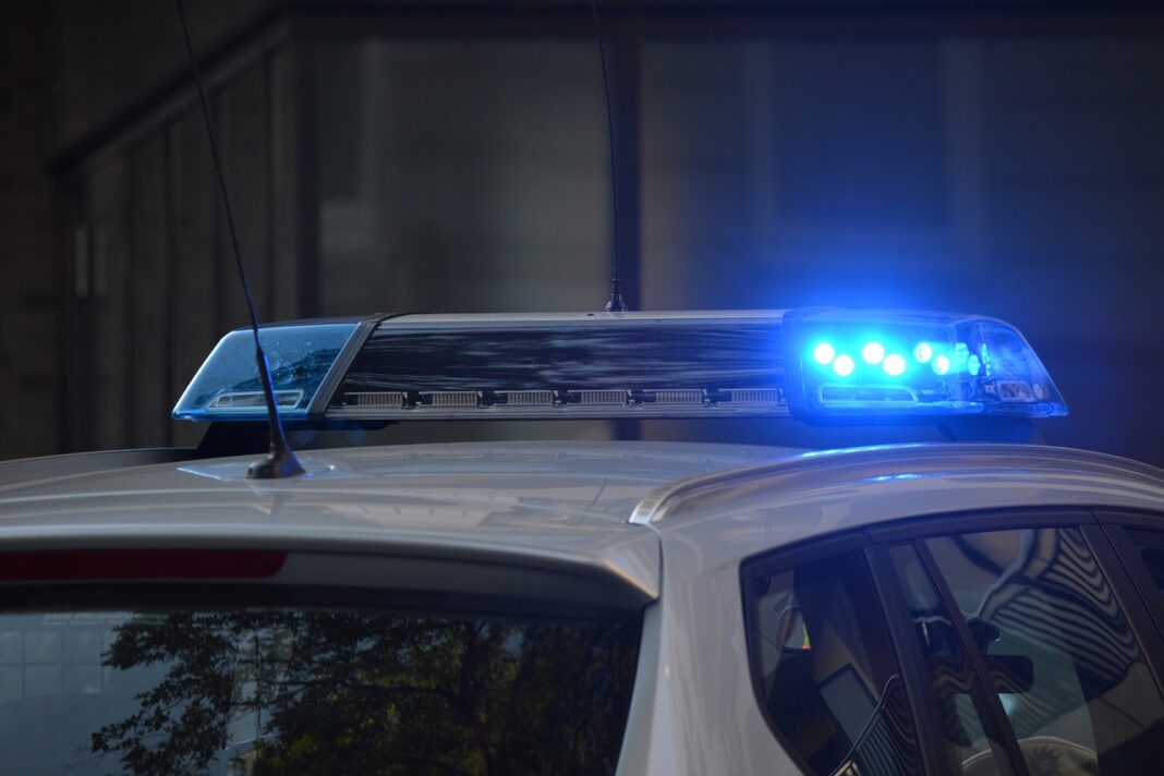 police-car police car flashing sirens at scene of accident