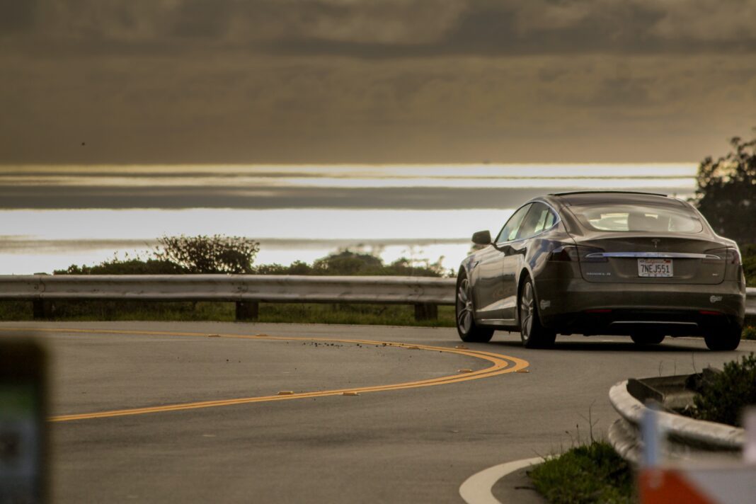 tesla-accident Gray Tesla driving on highway