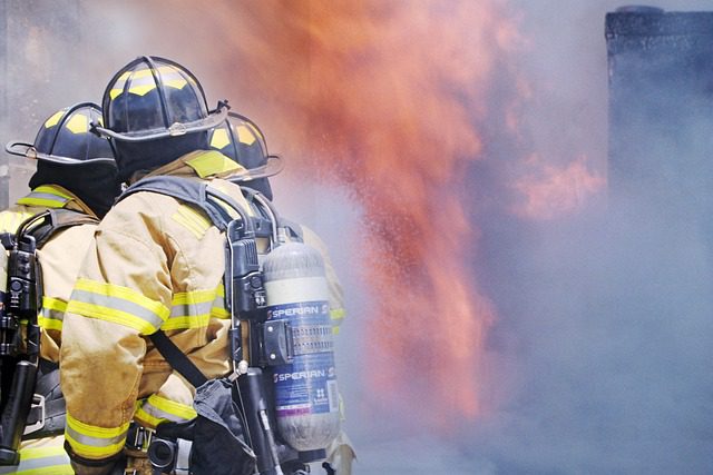 firefighter firefighters bracing dangerous house fire in attempt to put it out