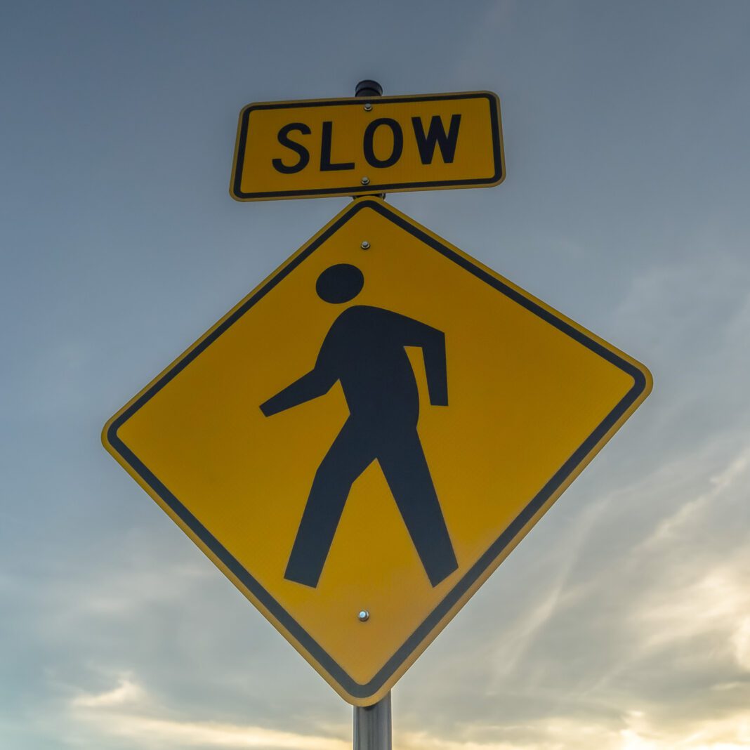 pedestrian-crosswalk pedestrian crossing sign depicted