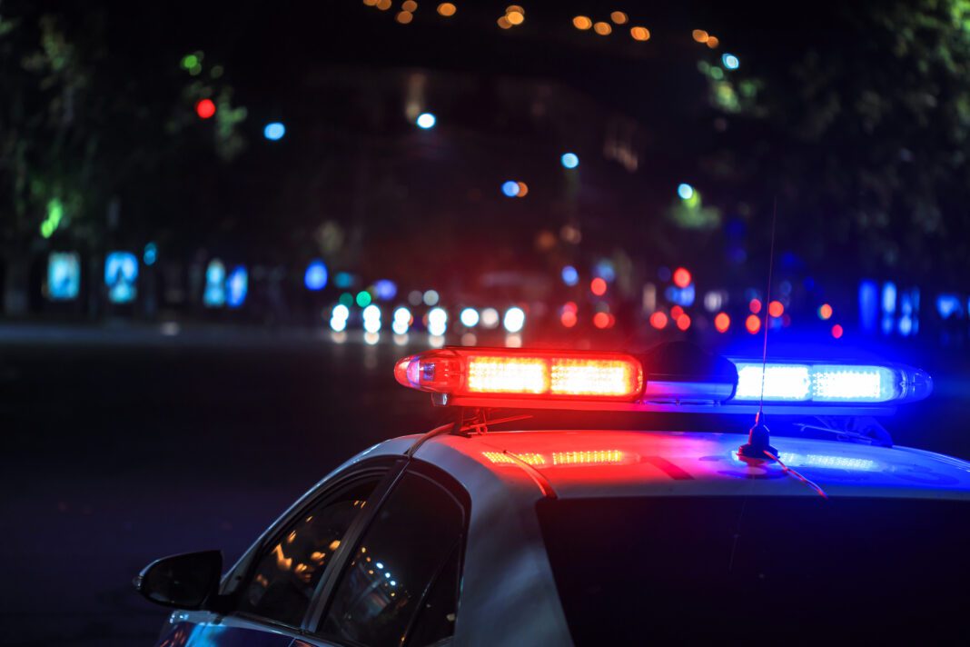 police-car police car depicted arriving at late night car crash