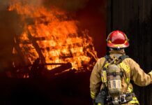 140 San Francisco Firefighters Battle Fire Near Hayes Valley firefighter attempts to put out large structural fire