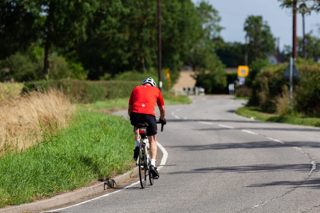bicycle bicyclist depicted riding bicycle on road