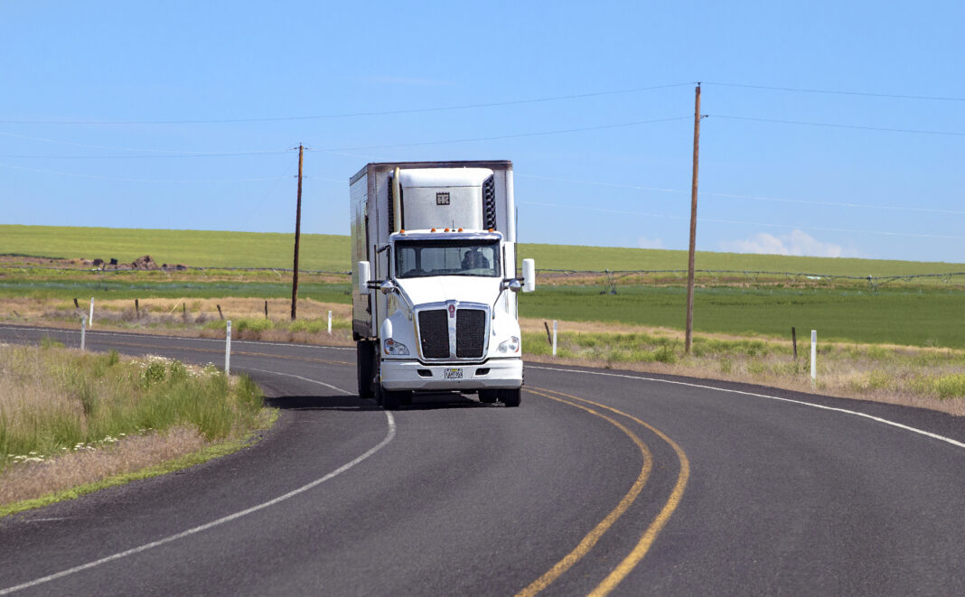big-rig semi truck depicted driving on highway