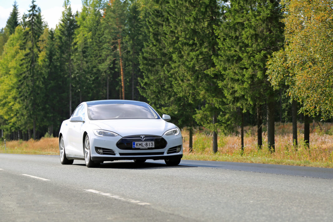 tesla tesla depicted driving on highway