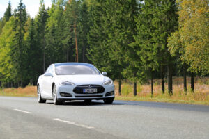 tesla depicted driving on highway