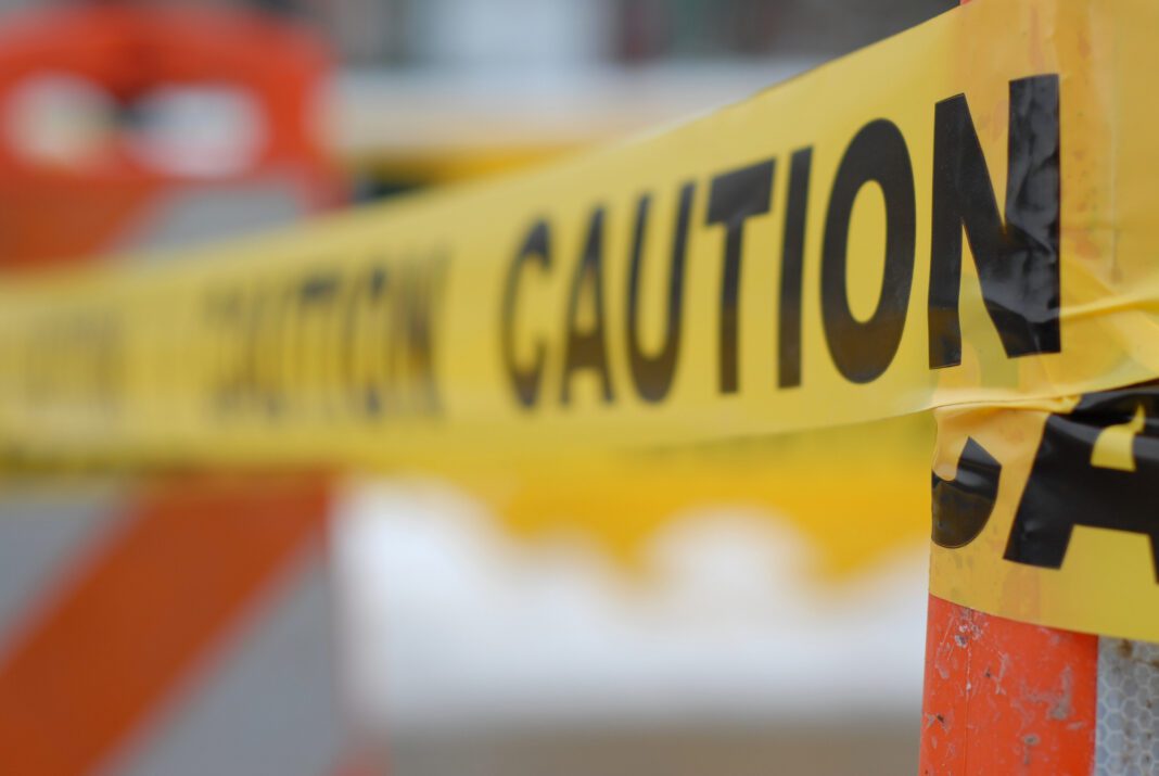 acid-spill caution tape depicted in hazardous area
