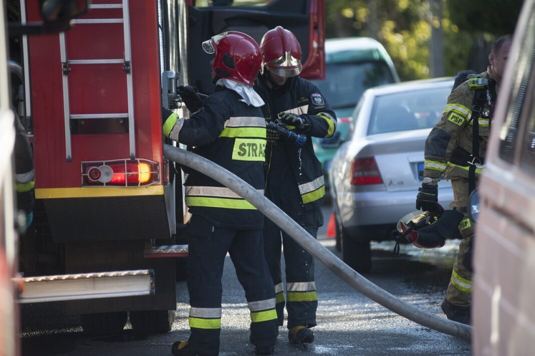 firemen firemen work to extinguish house fire