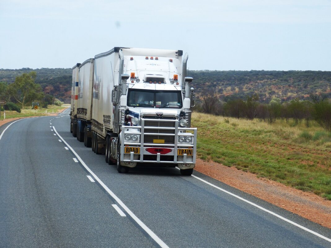 semi-trailer semitruck depicted driving on highway