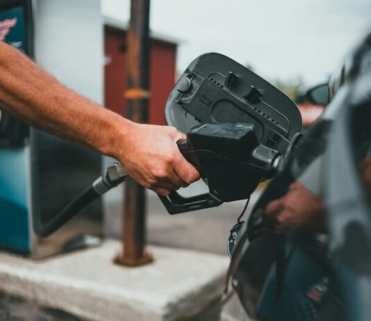 Car Involved In A Collision Topples Gas Pump, Trapping A Customer Underneath Car Involved In A Collision Topples Gas Pump, Trapping A Customer Underneath