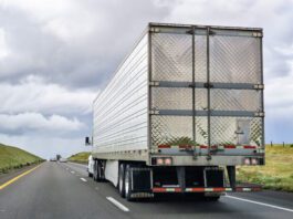Driver Hospitalized After Being Pinned Between Two Semi-trucks in Crash